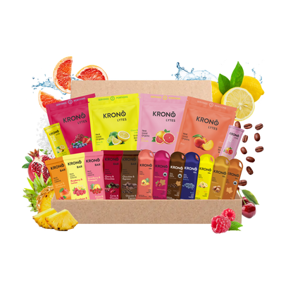 Assorted KRONO NUTRITION products in a box with fruit and berry graphics on a white background