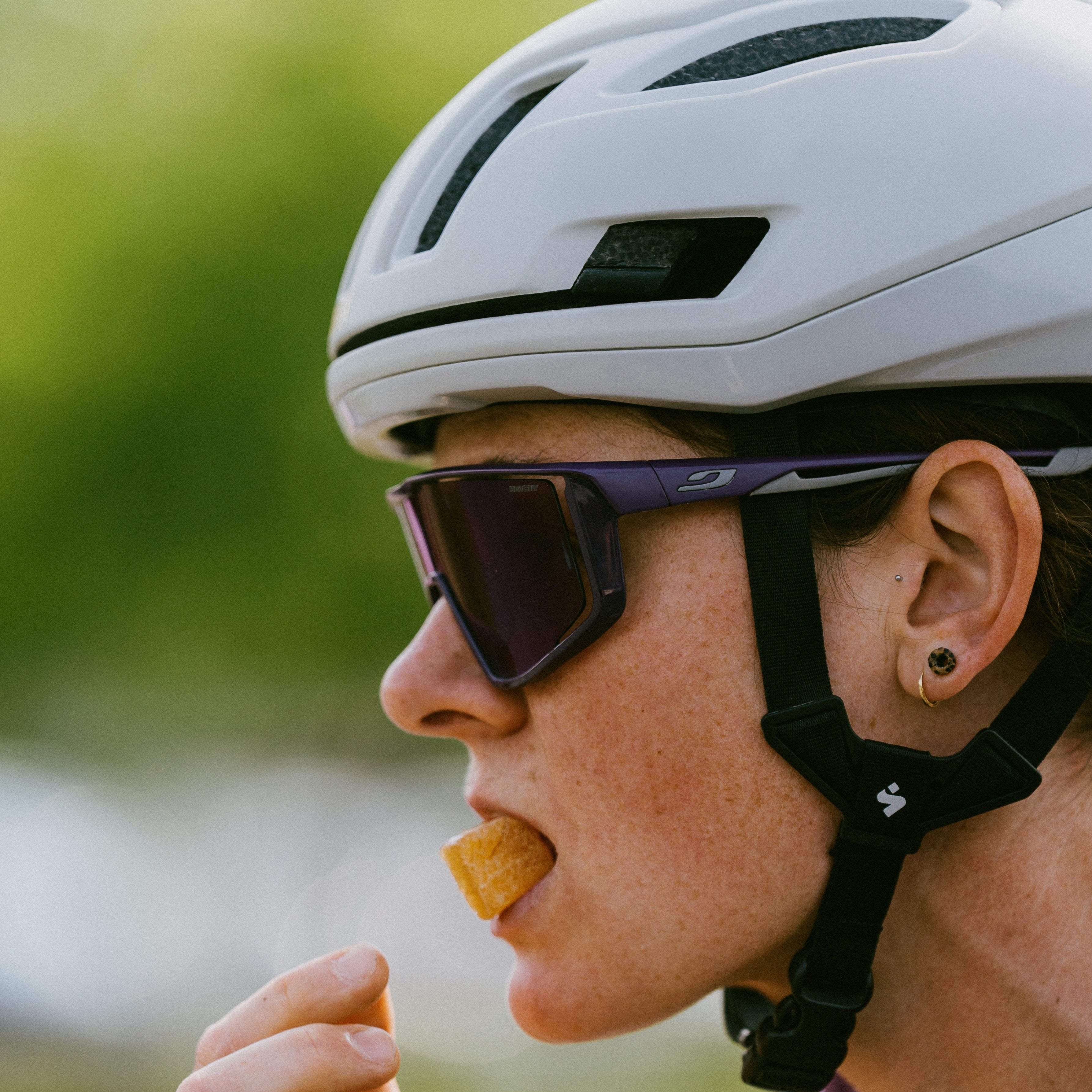 Cyclist eating Krono Nutrition maple and raspberry energetic chews