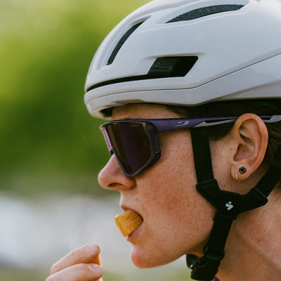 Cyclist eating Krono Nutrition maple and raspberry energetic chews