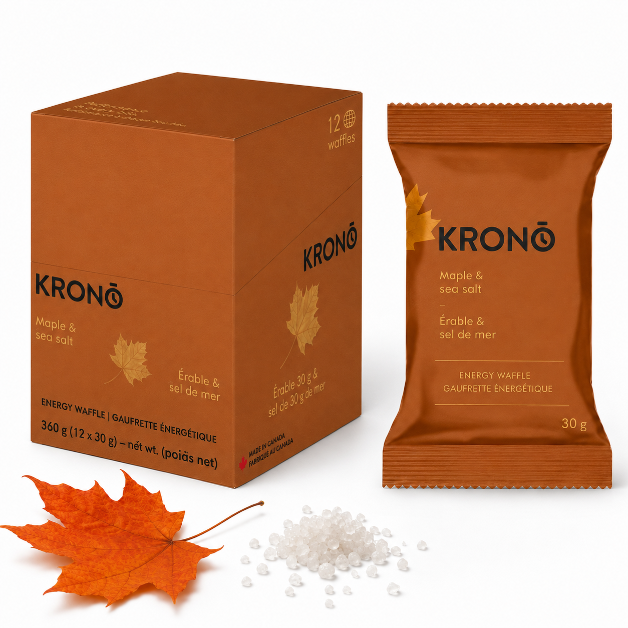 Krono Nutrition maple and sea salt energy waffle, in a box of 12 waffles, with a maple leaf and sea salt next to the box