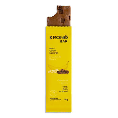 Krono Nutrition chocolate and banana protein bar with a bite taken out of it