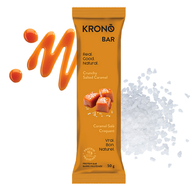 Krono Nutrition crunchy salted caramel protein bar, caramel and salt in the background
