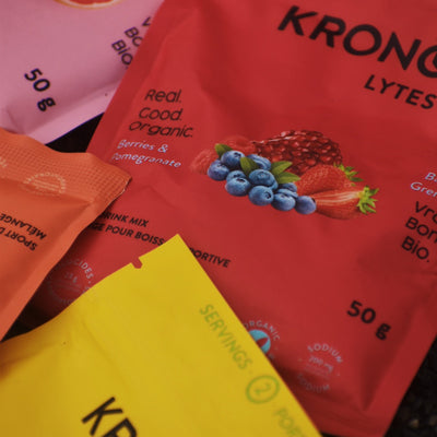 Close-up of all four Krono Nutrition variety pack sport drink mixes